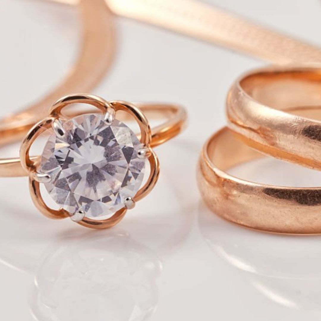 Rose gold rings and a solitaire-style ring with a gemstone, cast in 14k rose gold using lost wax casting.