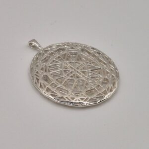 Intricate cast silver pendant with geometric lattice design