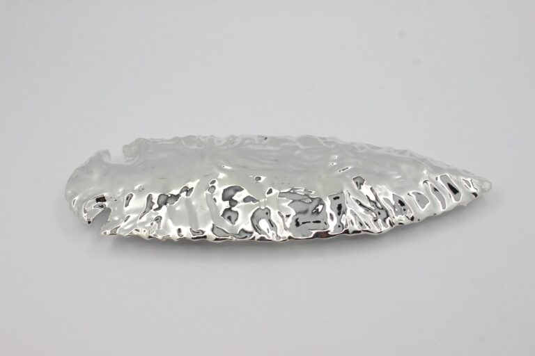 Lost wax cast sterling silver spear with polished, textured surface