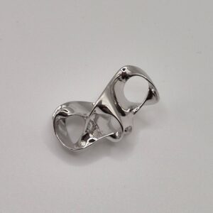 Showcase of a Highly reflective, chrome-plated brass casting with interlocking ring design, showcasing the sleek, mirror-like finish of 0.5 micron electroplating.