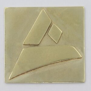 Casted sample of the Castimize logo in natural brass