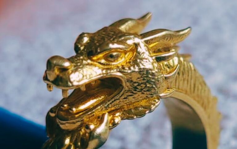 Zoomed side view of final casted Tripo AI dragon ring in brass