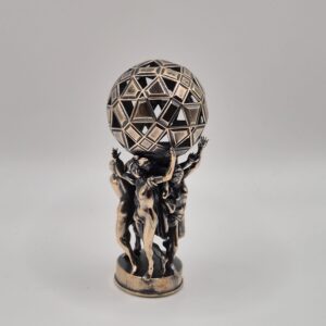 Antique bronze figurine holding geometric sphere